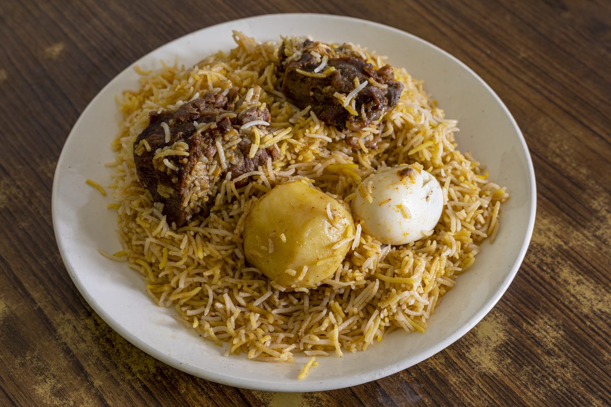 Plate of mutton biryani rice with boiled egg