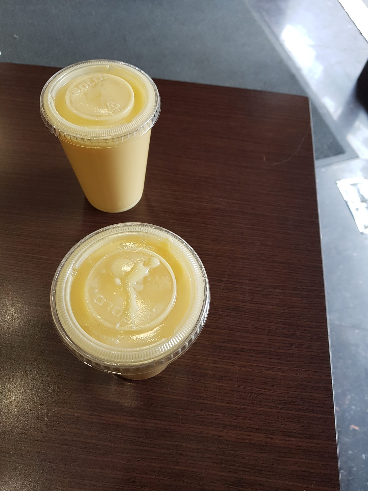 Two glasses of mango lassi